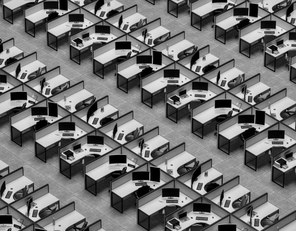 Purple-lit rows of office desks and workstations equipped by Rockors Nexus